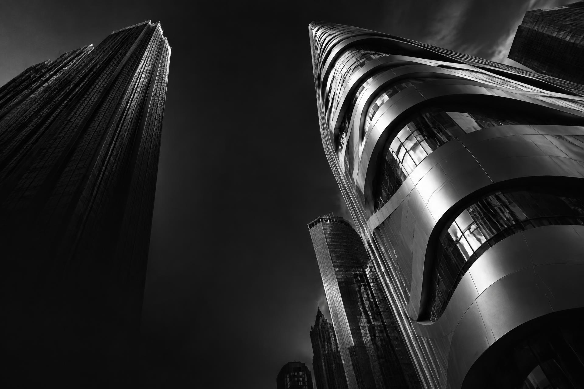 Sculptural glass and steel towers seen from below